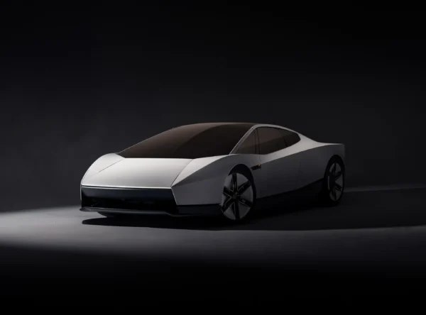 Novo Tesla Roadster branco visto de frente em três quartos, com carroceria aerodinâmica, faróis estreitos e rodas esportivas.